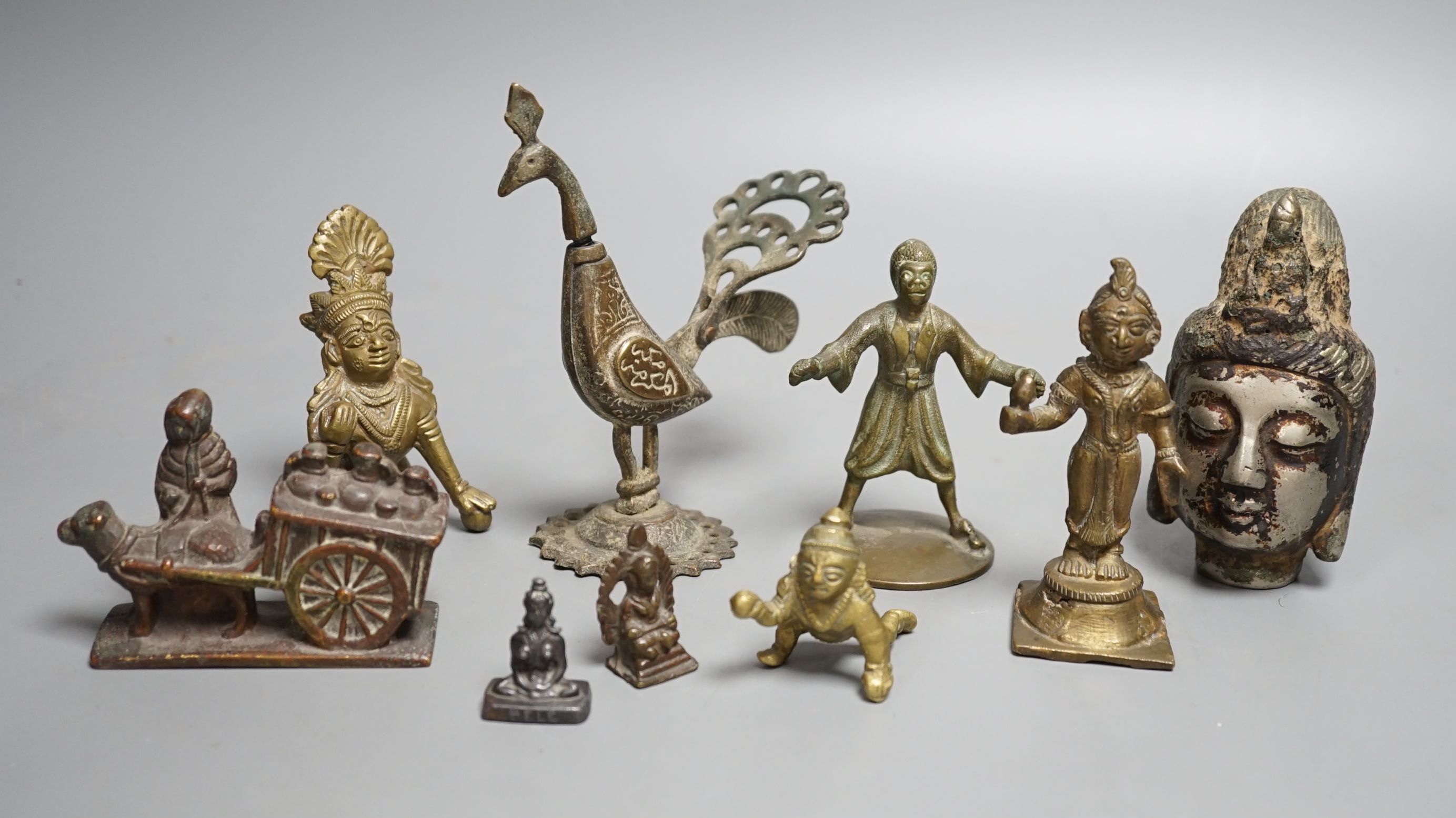 A group of Indian and Himalayan bronze and brass figures, Tallest 12 cm